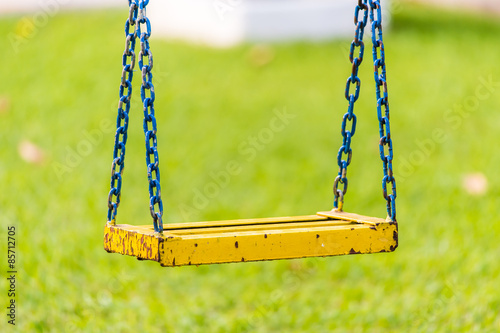 Empty chain swings in children playground