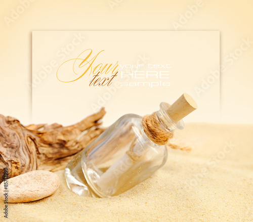 Summer sandy beach concept with letter in bottle