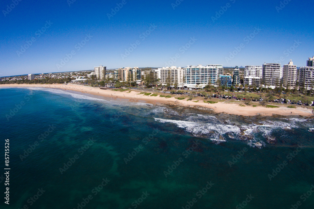 Aerial view of beachfront hotels on sunrise