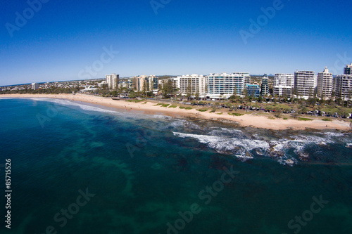 Aerial view of beachfront hotels on sunrise