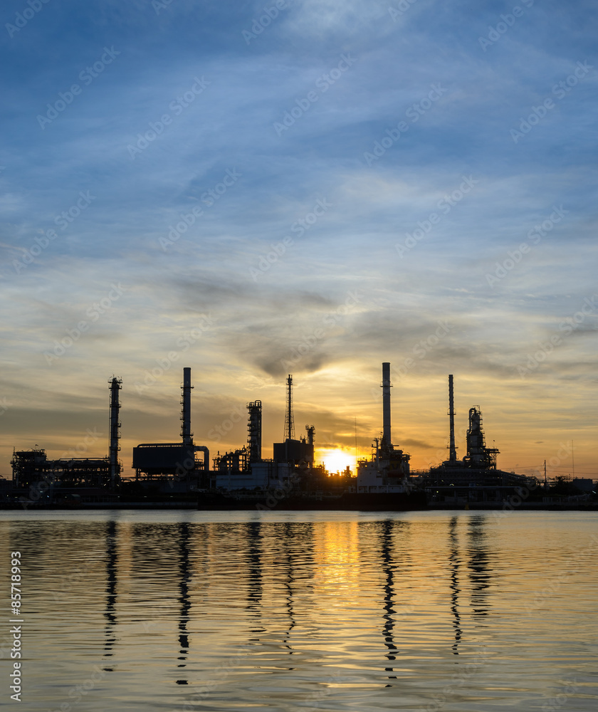 Oil refinery or petrochemical industry plant at sunrise