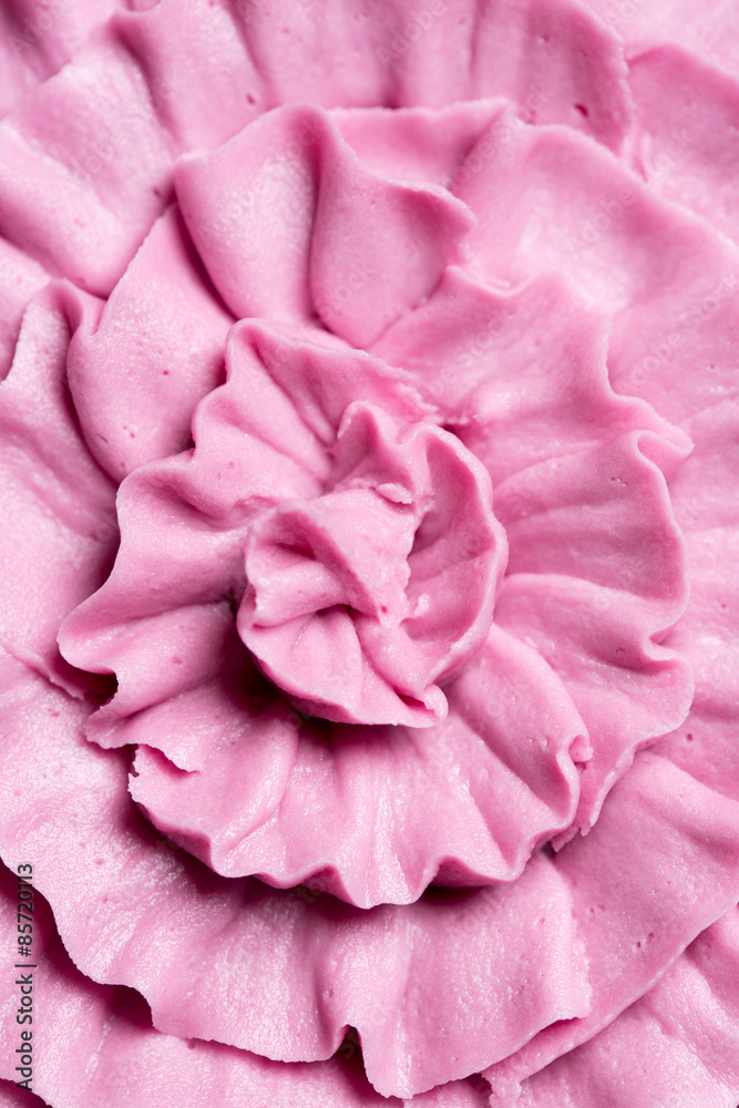 Decorative ruffled pink icing on a cake