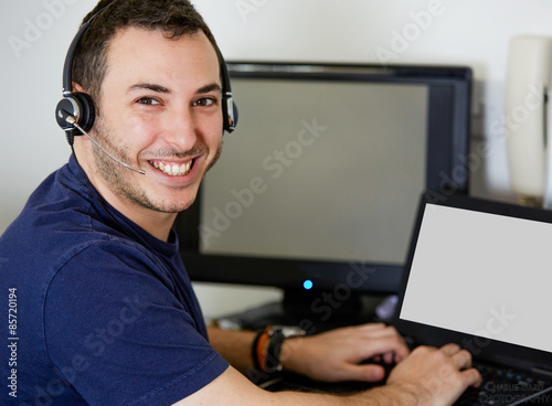 Young Call Center Agent Guy Smiling at the Camera