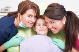 Friendly dental team and kid, boy or child patient