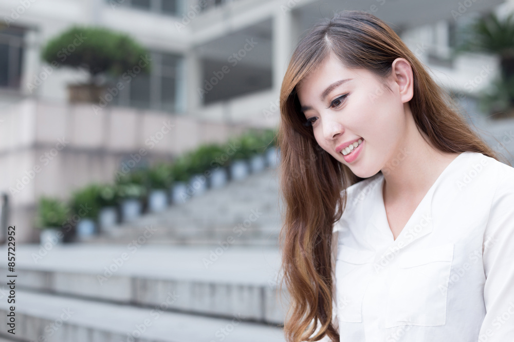 Asian beautiful female student portrait in campus