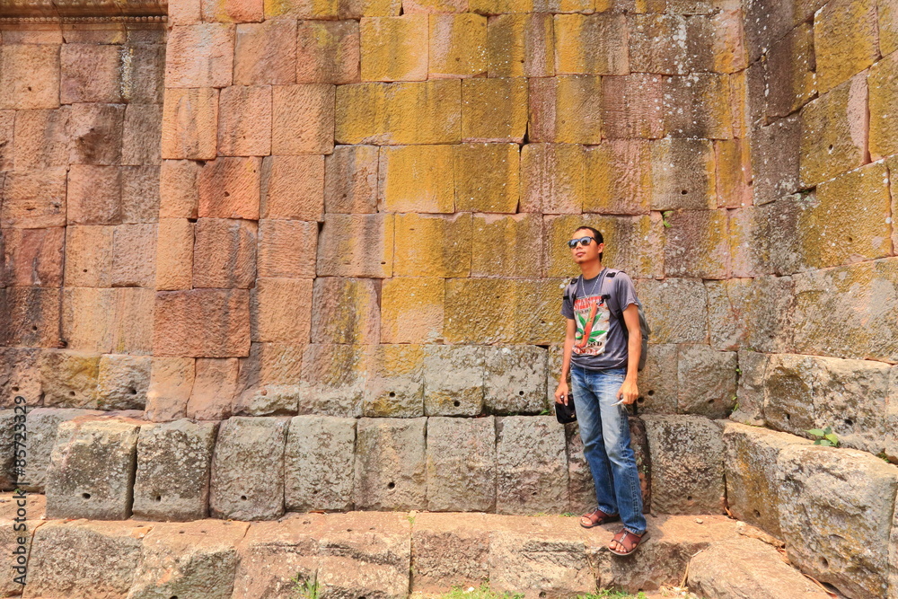 Man and The Wall of Prasat Hin Phanom Rung castle