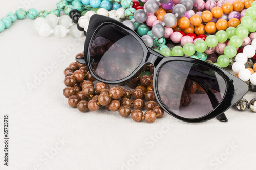 Sunglasses and beads - Stock image macro.
