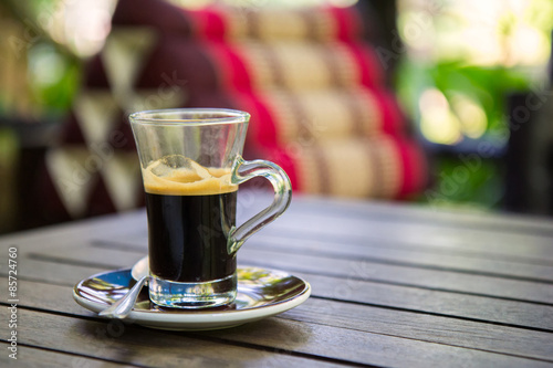 Black coffee on a wooden table