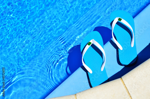 flip-flops on the swimming pool