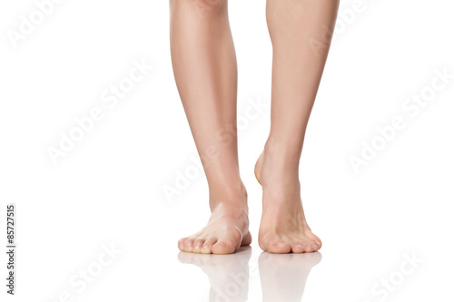 beautifully cared female feet on a white background