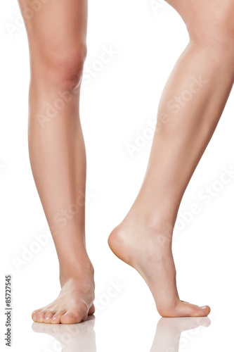 beautifully cared female feet on a white background © vladimirfloyd