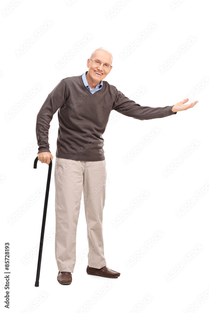Senior with a cane gesturing with his hand Senior with a cane gesturing with his hand