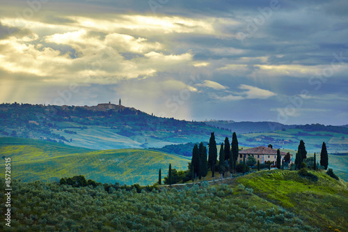 Tuscany  rural sunset landscape. Countryside farm  cypresses tre