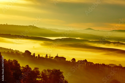 Scenic Tuscany landscape with rolling hills and valleys in golde © ZoomTeam