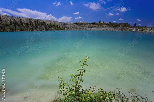 Flooded stone quarry. Crimea. Skalistoe village, Bakhchisaray region. Lake in quarry.