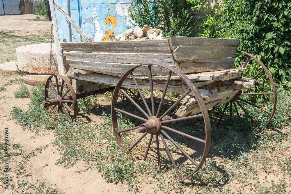 An old cart with stones.