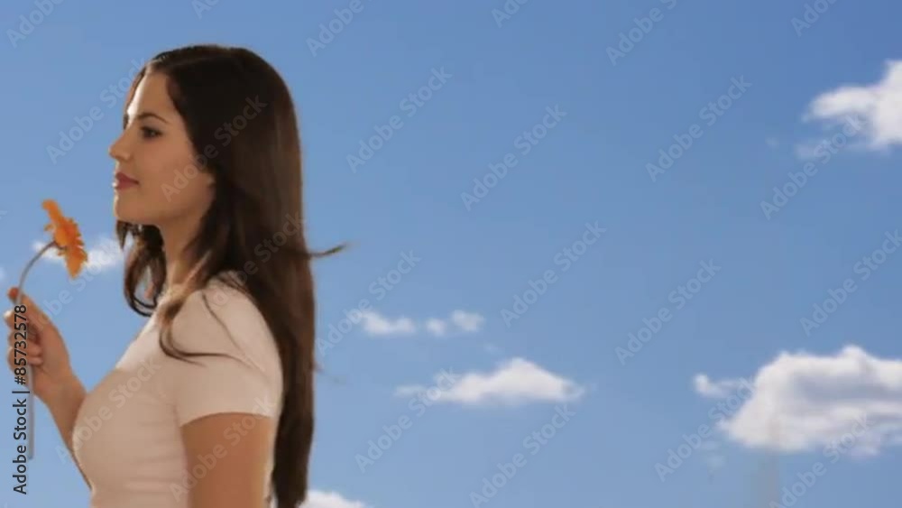 dolly shot of young woman walking with sky background dolly shot of young woman walking with sky background