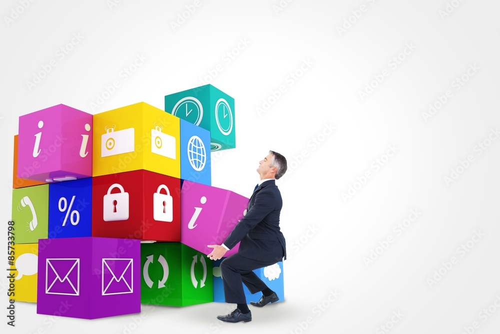 Composite image of businessman in suit carrying something Composite image of businessman in suit carrying something
