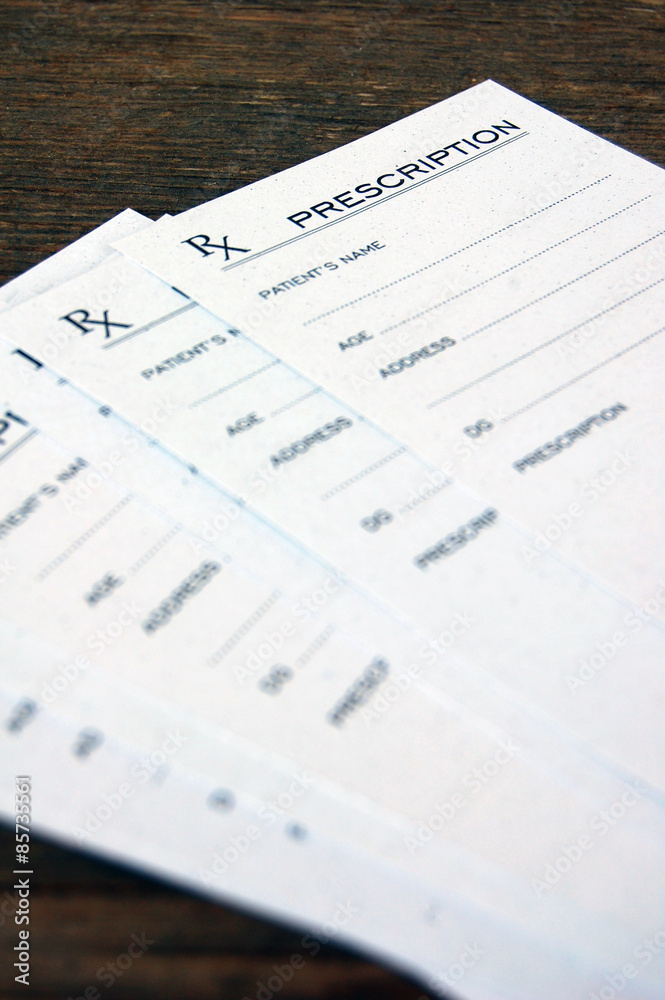 Blank prescriptions over wooden table