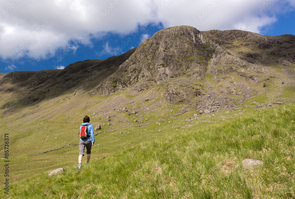 A hiker approaches Grey Knotts in the Lake District