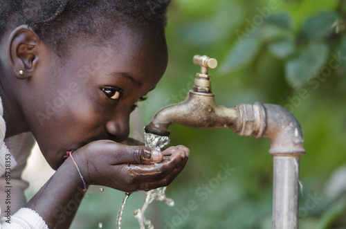 Social Issues  African Black Child Drinking Fresh Water From Tap
