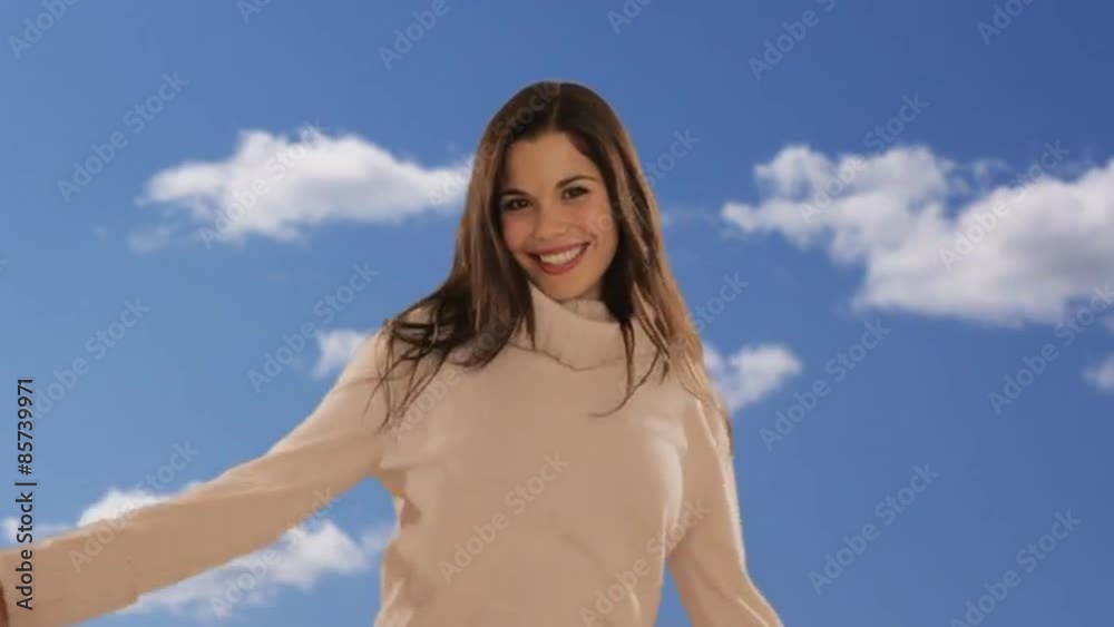 dolly shot of young woman twirling with sky background dolly shot of young woman twirling with sky background