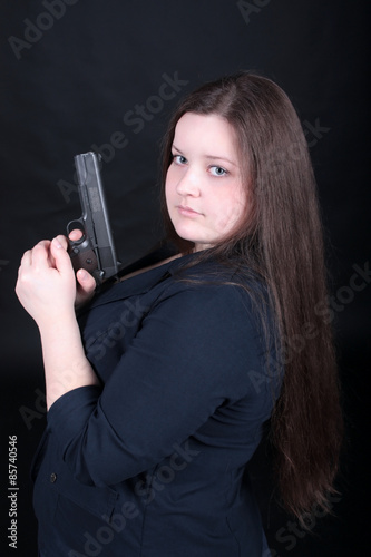 woman posing with guns.