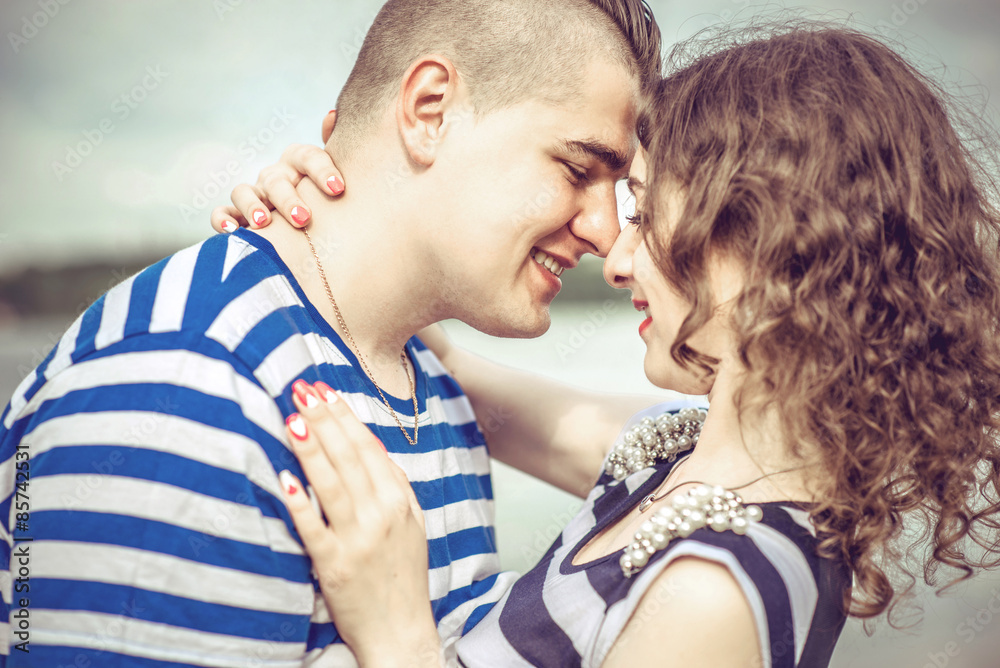 Pretty couple outdoor with lake on background Pretty couple outdoor with lake on background