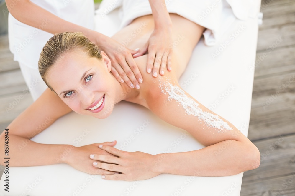 Beautiful woman lying on massage table Beautiful woman lying on massage table