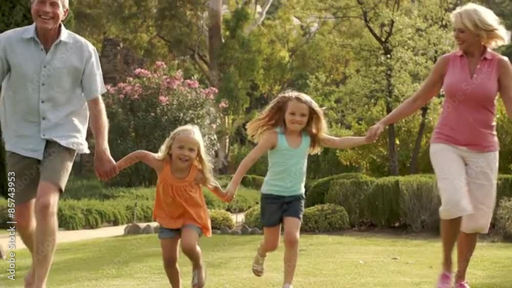 Slow motion grandparents and two granddaughters running over camera. Slow motion grandparents and two granddaughters running over camera.