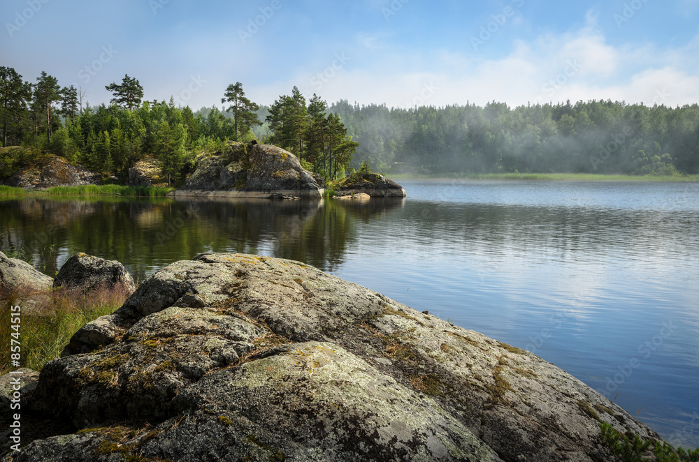 Obraz premium stones over the lake waters