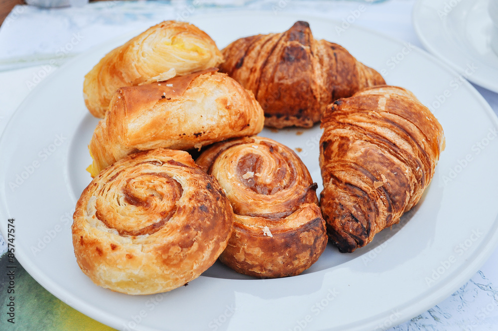 Puff crispy rolls on a white plate Puff crispy rolls on a white plate