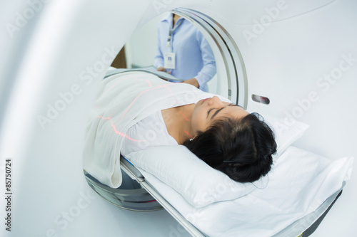 women entering the brain with a Ct scan photo