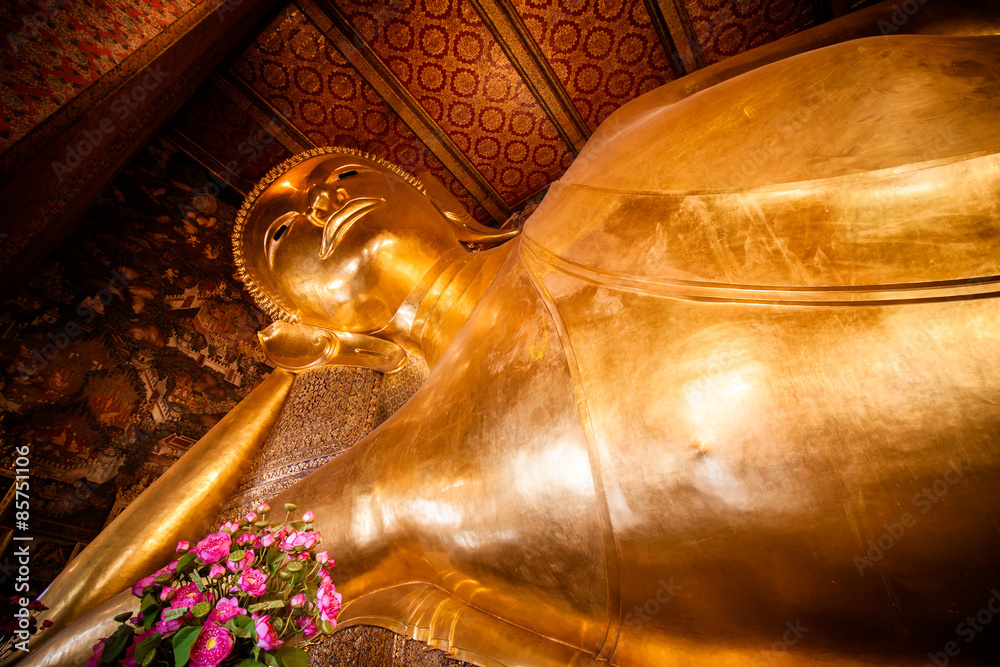 The image of golden reclining Buddha at Wat Pho Temple Thailand