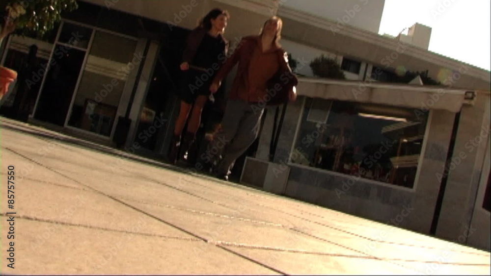 Couple in town, running together Couple in town, running together