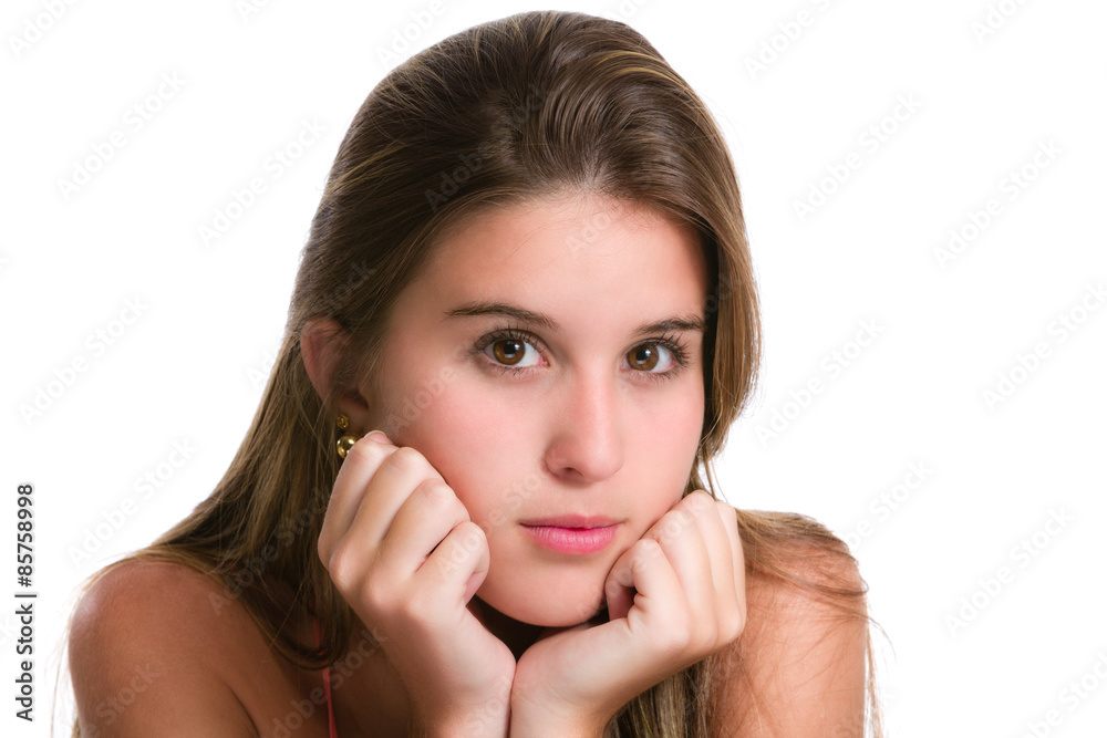 Hispanic young woman with serious expression and hands on chin. Hispanic young woman with serious expression and hands on chin.