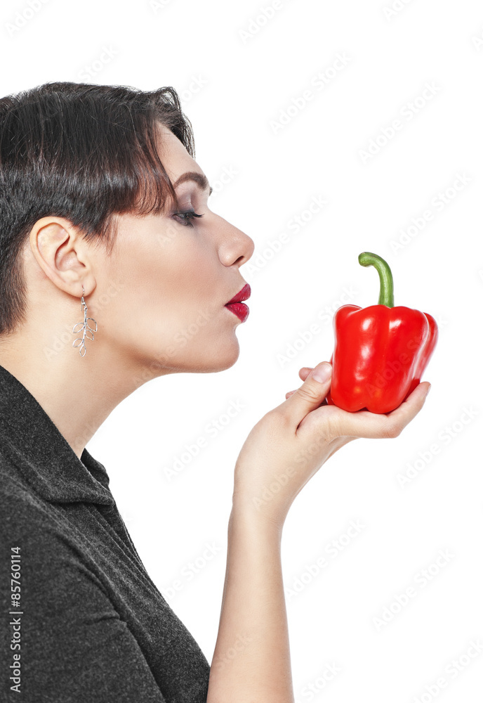 Beautiful plus size woman with red pepper isolated Beautiful plus size woman with red pepper isolated