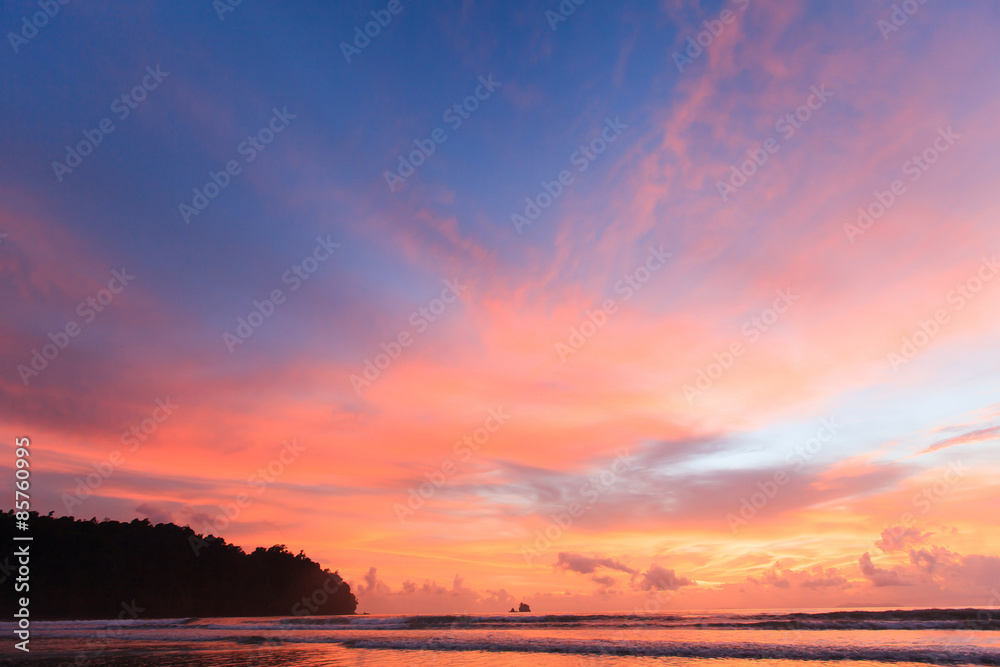 Beautiful sunset sky over tropical beach.