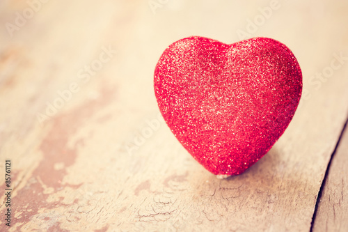 Valentine day concept. Heart on grunge wood background.