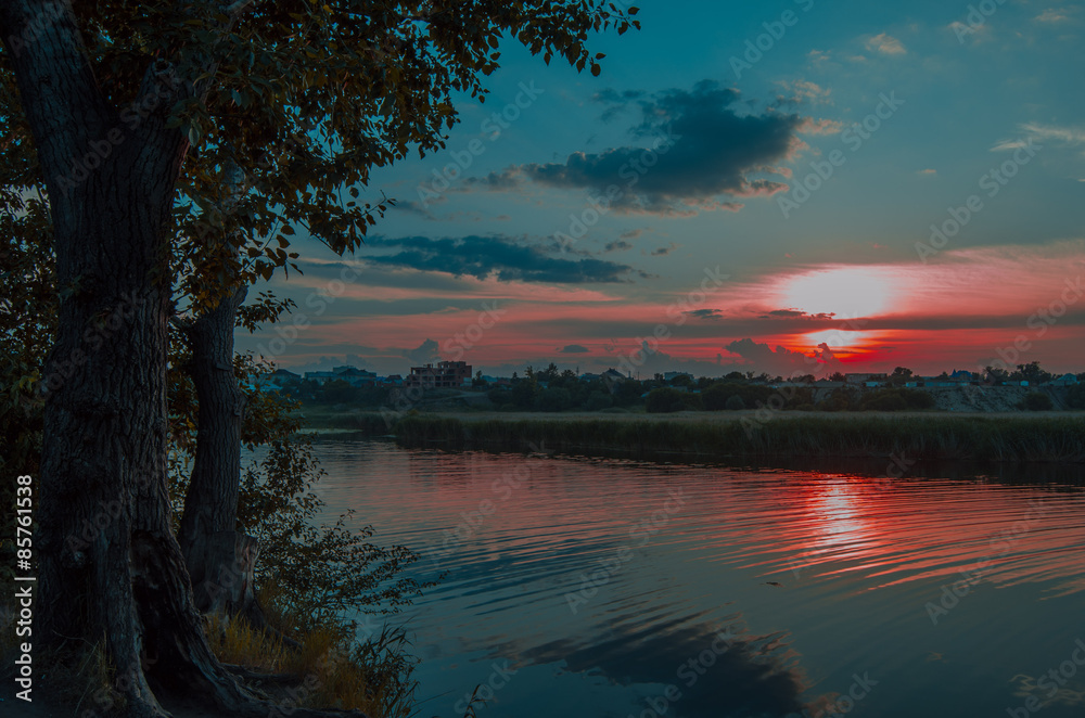 Crimson sunset over the river