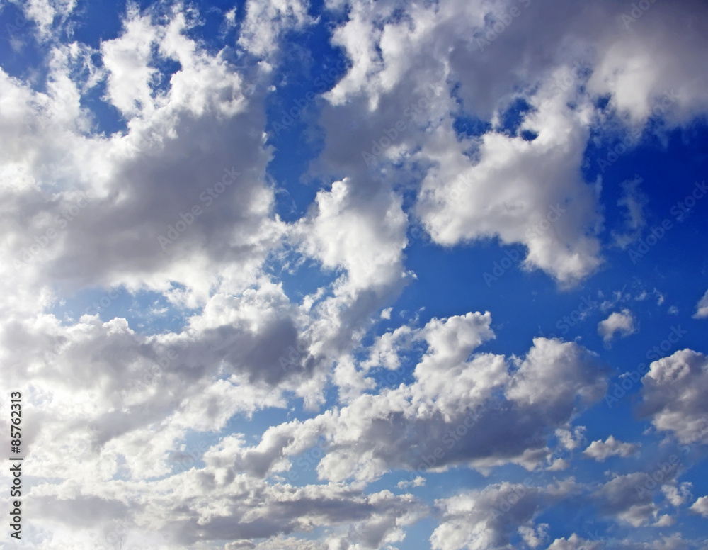 Blue sky with fluffy white clouds in day light Blue sky with fluffy white clouds in day light
