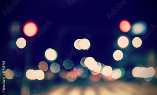 Retro toned blurred street lights.