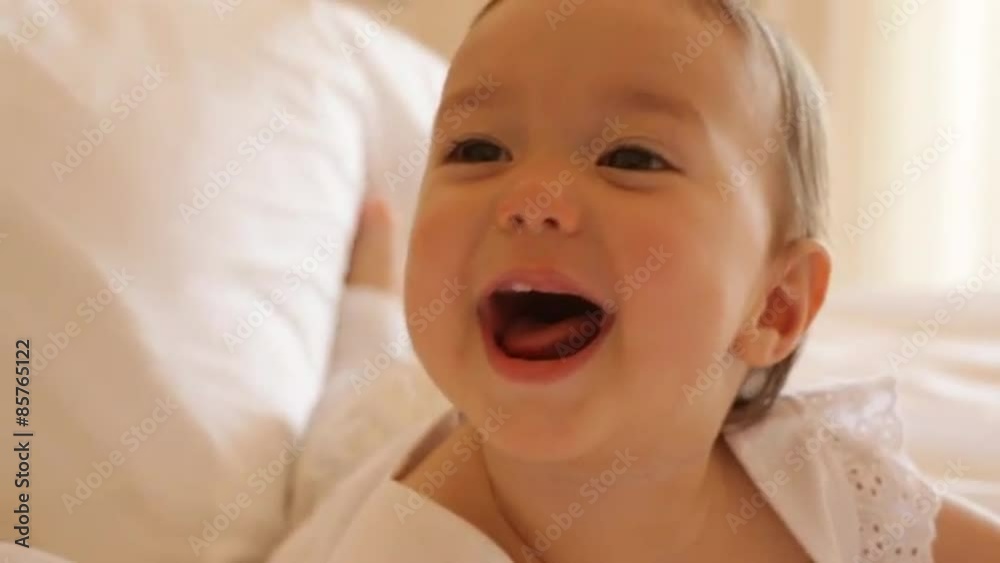 Baby lying on bed Baby lying on bed