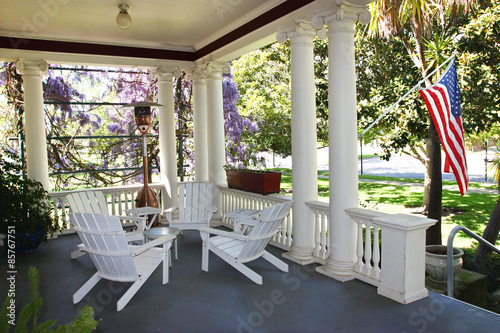American flag hanging on house porch