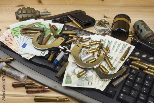 Internet illegal arms trade. Merchant arrest illegal ammunition. Internet crime. Current euro banknotes and Czech koruna.
