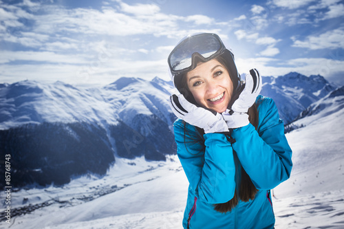 Smiling girl blue jacket alps mountain resort