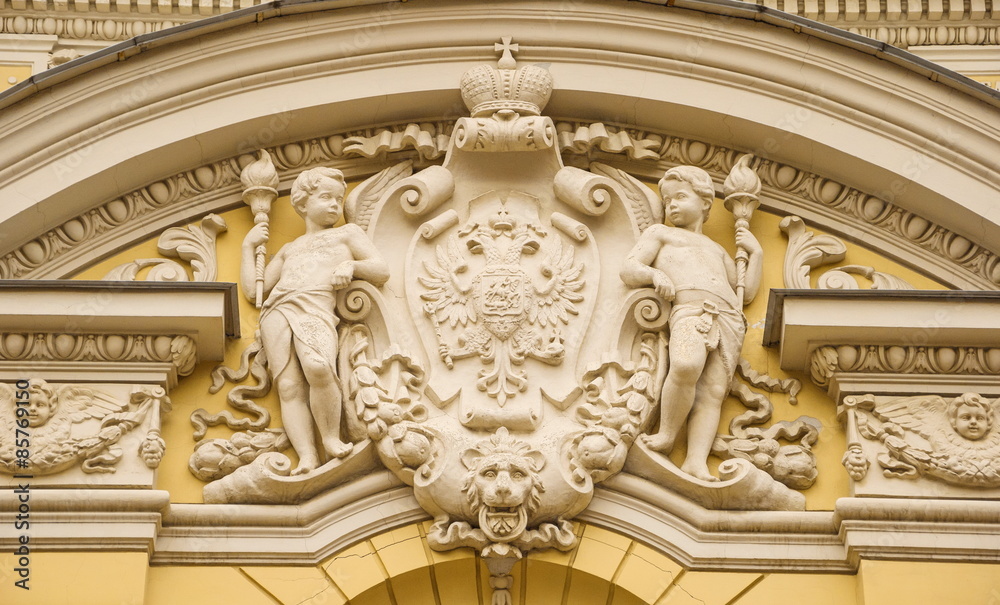  bas-relief with coat of arms of Russian Empire on one of  old houses of St. Petersburg