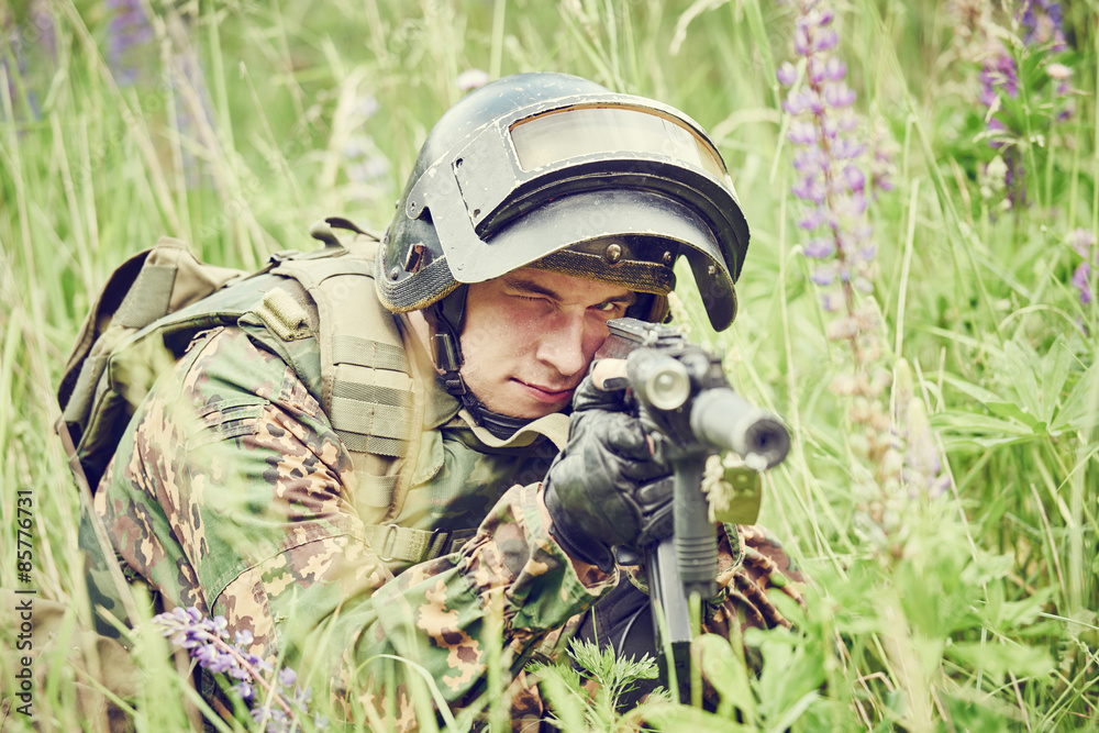 Military soldier with assault rifle