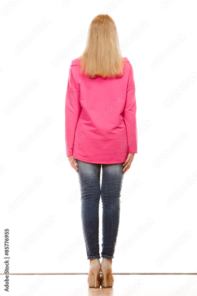 woman in denim pants pink blouse back view woman in denim pants pink blouse back view