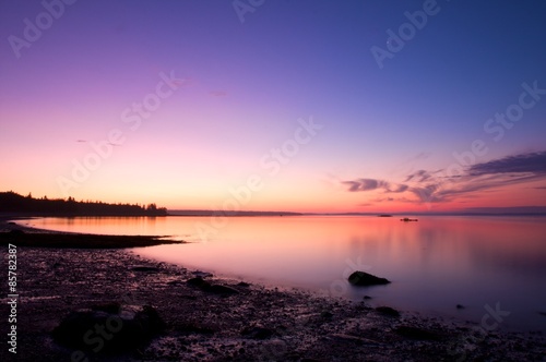 stunning view of sunrise in maine over a calm lake